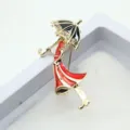 Detailed view of enamel girl with umbrella brooch showing rhinestones and red finish - Girl with Umbrella Style (U-1-2601)