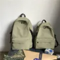 Minimalist sage green water-repellent nylon backpack in two sizes for school or travel - L / Green