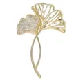 Detailed macro view of elegant golden ginkgo brooch with sparkling micro-paved zircons - Gold