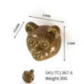 Detail macro view of brown ceramic bear head drawer knob with 31x32mm dimensions and 30g weight - Coffee