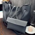 Borsa a tracolla grigia in ecopelle con motivo litchi e pochette abbinata, stile casual chic. - Grigio scuro