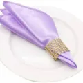 Elegant lavender satin cloth napkin with sparkling gold sequin ring for table decor. - Light Purple