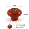 Red ceramic drawer knob with bronze flower motif, 32mm diameter, single hole handle. - Round TCL964-2-2
