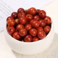 Polished round golden Phoebe wooden beads with hole for handmade DIY jewelry making - Red Pearwood Round Bead