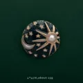 Detailed view of celestial sun moon and stars brooch with pearl and crystals - Star