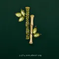 Close-up of bamboo lapel pin with green crystal leaves and gold-tone stems - Bamboo