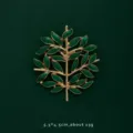 Detailed view of elegant green enamel leaf brooch with gold-plated finish and size info - Tree