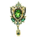 Spilla a fiore vintage dorata con un grande cristallo verde a forma di pera - Verde