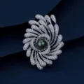 Close-up of a luxury firework-shaped brooch with sparkling crystals and a dark pearl center. - Silver Firework Black Pearl