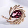 Elegant starburst brooch with large purple teardrop crystal and colorful rhinestones - Purple