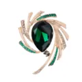 Elegant starburst brooch with green teardrop crystal and sparkling rhinestones - Green