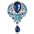 Elegant vintage alloy brooch with blue teardrop crystals and turquoise bead accents - Sapphire Blue