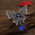 Vintage silver butterfly brooch with blue rhinestones and faceted water-drop pendant - Blue
