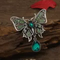 Vintage silver-tone butterfly brooch with green crystals and elegant teardrop pendant - Green