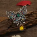 Vintage hollowed butterfly brooch with multi-color rhinestones and yellow teardrop - Multi-color