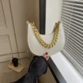 Elegant white felt crescent handbag with textured alligator pattern and chunky gold chain strap - White