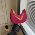 Chic magenta felt crescent underarm bag featuring a stylish chunky gold chain strap - Rose Red