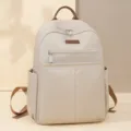 Minimalistischer beiger Damenrucksack aus Oxford-Gewebe mit braunen Lederakzenten - Gebrochenes Weiß