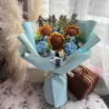 Detailed view of handmade crochet bouquet with sunflowers and blue roses for graduation - Exam Success + Gift Bag & Card / Blue