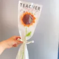 Handmade crochet sunflower bouquet in clear wrap with teacher day theme gift design. - Sunflower Bouquets