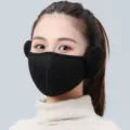 Close-up of model wearing black winter 2-in-1 fleece warm mask with earmuffs - Integrated Style (WHHT531-D) / Black