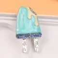Detailed view of a cute blue enamel popsicle brooch featuring sparkling blue rhinestones - Double Popsicle Style (Blue) / Blue