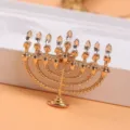 Close-up of golden Hanukkah Menorah brooch with sparkling rhinestone flames - Menorah Shape (O4-3-5317)