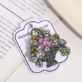 Close-up of a sparkling flower basket brooch with colorful rhinestones on a card - Silver Pink Flower Basket (Style 4)