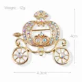 Detail view of a golden Cinderella pumpkin carriage brooch with dimensions and weight info. - Pumpkin Carriage Style