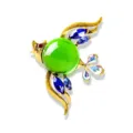 Charming gold-tone bird brooch featuring a large green jelly glass belly and blue crystals - Colored Birds / Green