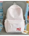 Sac à dos d'écolier à motif marbré rose et blanc avec broderie MZ Lucky détaillé. - Rose