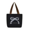 Bolso tote de lona negra minimalista con estampado de lazo blanco y asas marrones para diario - Lazo Negro