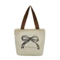 Bolso tote de lona minimalista con elegante estampado de lazo negro y asas marrones - Blanco Crema con Lazo