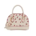 Elegante cremefarbene Muschel-Handtasche mit süßem Kirschprint und Riemen - Weiß