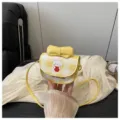 Minibolso bandolera de cuadros amarillos con estampado de perro de dibujos y lazo - Amarillo