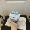 Mini bolso bandolera de cuadros azules y blancos con estampado de perro y un lazo - Azul