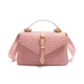 Bolso bandolera rosa con textura tejida a la moda y una correa de hombro ancha chic. - Rosa