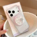 Close-up of mother-of-pearl apple-shaped rotating stand on a soft pink iPhone case - Transparent Magnetic/Gilded White Texture/Glitter Star Shell/Magnetic Stand / iPhone 17 Pro Max