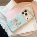 Detailed view of cute picnic cartoon phone case with cat and dog illustration - Forest Picnic Style / iPhone 17 Pro Max