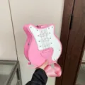 Unique pink electric guitar shaped crossbody bag for women with adjustable shoulder strap - Guitar Shape / Pink