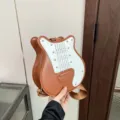 Unique guitar-shaped brown and white crossbody bag with adjustable shoulder strap - Guitar Shape / Brown