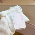 Detailed close-up of a clear iPhone case featuring sweet pink glittery apple and star motifs - iPhone 17 Pro Max / Transparent Gilded Pink Apple (Case Only)