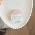 Detailed view of pink glitter house magnetic phone grip with blue bow patterns - Single Stand / Pink Shell House