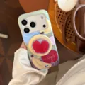 Close-up detail of dopamine graffiti iPhone case featuring apple pattern and phone stand - Magnetic Case + Red Fruit Stand Set / Colorful Fruit Platter / iPhone 17 Pro Max