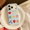 Detailed view of a light blue iPhone case with cute fruit graffiti and MagSafe circular magnet - Magnetic Style / Blue Colored Fruit / iPhone 17 Pro Max