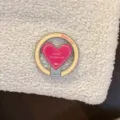 Close-up of pink heart-shaped phone ring holder on cream sherpa fleece phone case - [Single Stand] / Berry Pink Heart Magnetic Stand