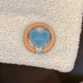 Detailed view of a trendy heart-shaped phone grip in vibrant blue and orange colors - [Single Stand] / Orange Blue Heart Magnetic Stand