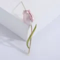 Close-up of an elegant pink enamel tulip brooch featuring a golden stem and green leaf detail - Pink
