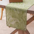 Green linen-style table runner with white fern leaf print on wooden table - Leaf Hemmed Style / 30x160cm / Green