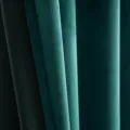 Close-up showing the rich texture and elegant folds of forest green velvet curtains - Turquoise Green